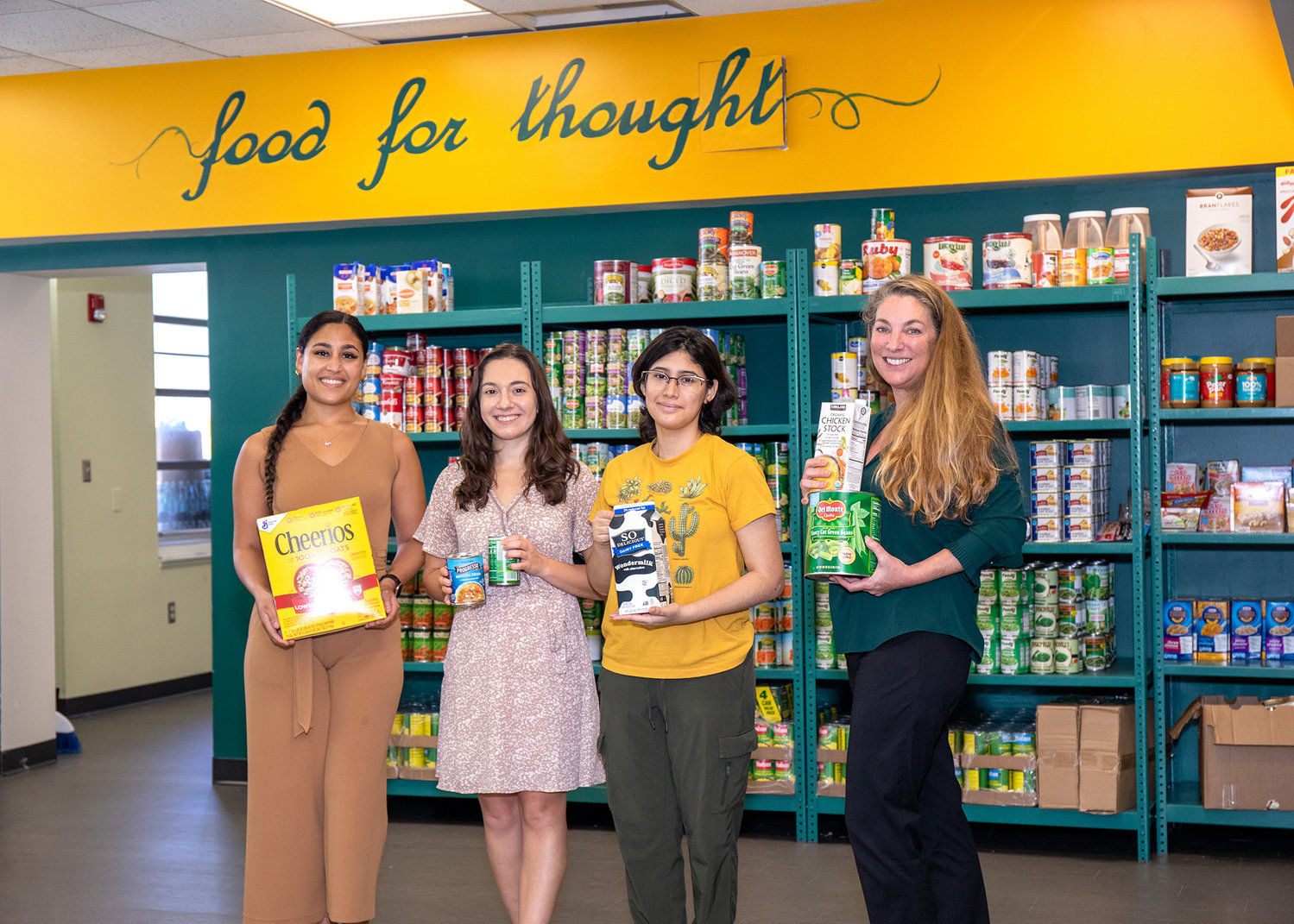 Robin Russo, a licensed clinical social worker and PBSC’s director of student well-being, Vanessa Gonzalez, Counseling Center specialist, Gina Cipriano, mental health intern and Raquel Dyer, a student worker, stand in the Lake Worth campus Panther’s Pantry, which was recently renovated.